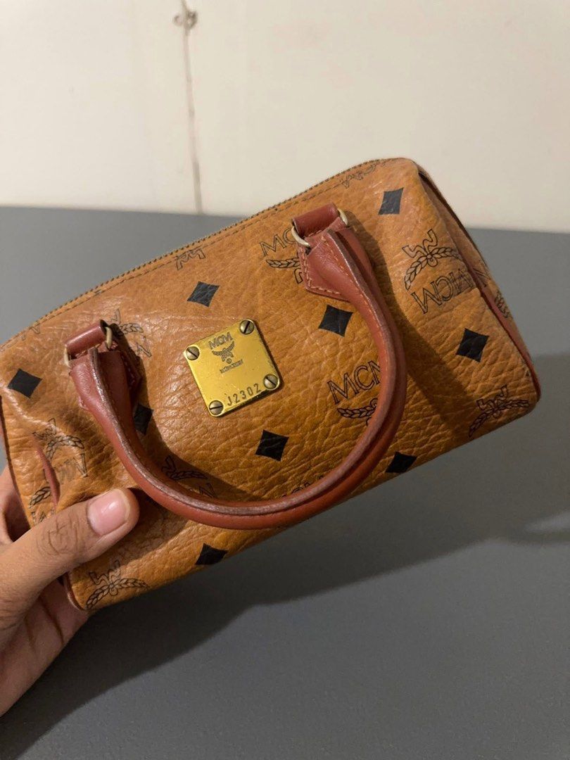 Authentic McM Nano Bag (Category: Luxury Bags & Wallets) located in Quezon City. Submitted by jhaediah (Listing ID 1366068457, Image 3). Description: preloved and good condition Nano m CM Cute! Bili nalang kayo ng strap .