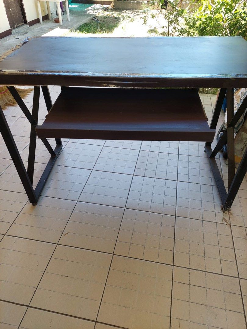 Computer table (Category: Tables & Sets) located in Paranaque City. Submitted by captainthanos01 (Listing ID 1366062028, Image 1). Description: Metal legs and stand Wooden top with a water damage .