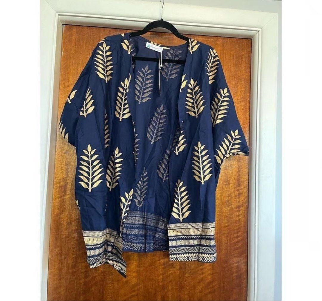 Oversized kimono topper coverup plus size (Category: Others Tops) located in Cainta. Submitted by kei_21 (Listing ID 1362032807, Image 1). Description: Closet cleanup sale Decluttering Bnew Still tag attached Size on tag 2xl Can fit xl-xxl Color: navy blue with gold print Made india Very nice Presko fabric Rfs: unwanted gift Loc: pasig.