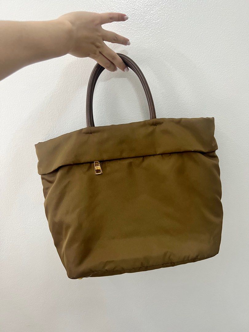 Prada Bag (Category: Luxury Bags & Wallets) located in Paranaque City. Submitted by syninja (Listing ID 1366116817, Image 2). Description: Prada BN2531 Corinto Tessuto Saffian Brown Nylon and Leather Shopping Tote Bag Very good condition - a few minor flaws, not so noticeable especially from afar (see pics) Can be used as an everyday bag Material: Tessuto Saffian(Nylon and leather) Dimensions: 14.5 x 11 x 6 inches Inclusions: authenticity cards a
