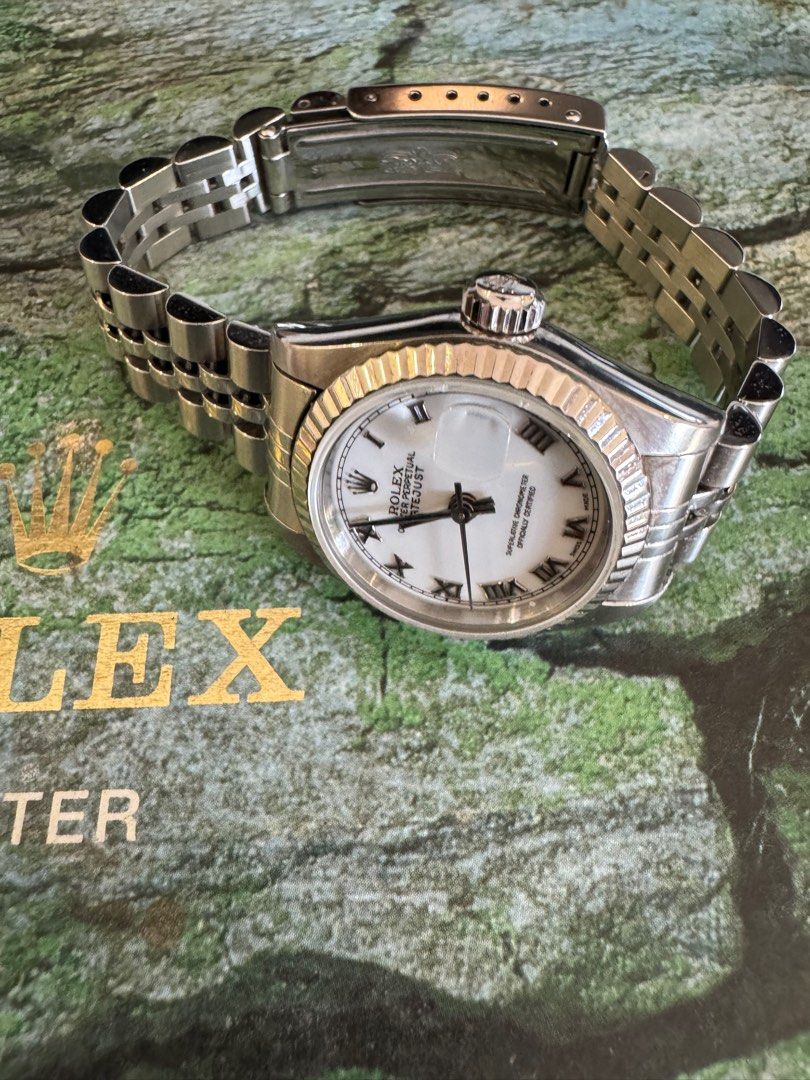 Rolex Datejust 26mm (Category: Luxury Watches) located in Paranaque City. Submitted by jaydy118 (Listing ID 1366039407, Image 2). Description: Brand: Rolex Model: Datejust 26 Case: Steel Bezel: White gold Diameter: 26 mm Bracelet: Steel Jubilee Movement: Automatic Dial: White with roman numerals Glass: Sapphire crystal Condition: 9/10 Watch only Open for verification.
