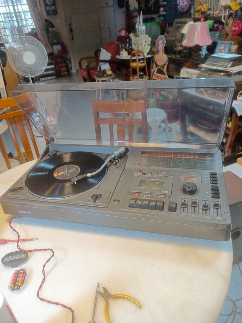 Sharp 3 in 1 set player. (Category: Other Audio Equipment) located in Singapore. Submitted by yankhimt (Listing ID 1366098753, Image 1). Description: Play 33 & 45 record. FM radio working, only cassette player not working.Length- 37cm, diameter 73cm. height- 16cm .Model no- SG 320X..