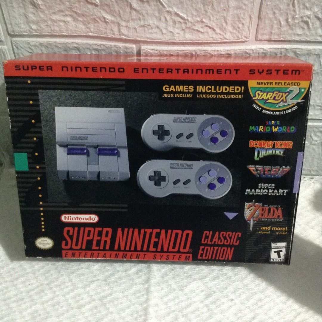 SUPER NINTENDO ENTERTAINMENT SYSTEM CLASSIC EDITION (Category: Nintendo) located in Quezon City. Submitted by tammys_random_harvest (Listing ID 1366023052, Image 1). Description: Dimensions: 8 x 3 x 10in; 2.12lbs ITEM DESCRIPTION: 16-bit Core Video Game Console Stereo sound For up to 2 players 21 built-in games: Super Mario World, Super Mario Kart, Super Mario Legend of the Seven Stars, The Legend of Zelda: A Link to the Past, Street Fighter II, 