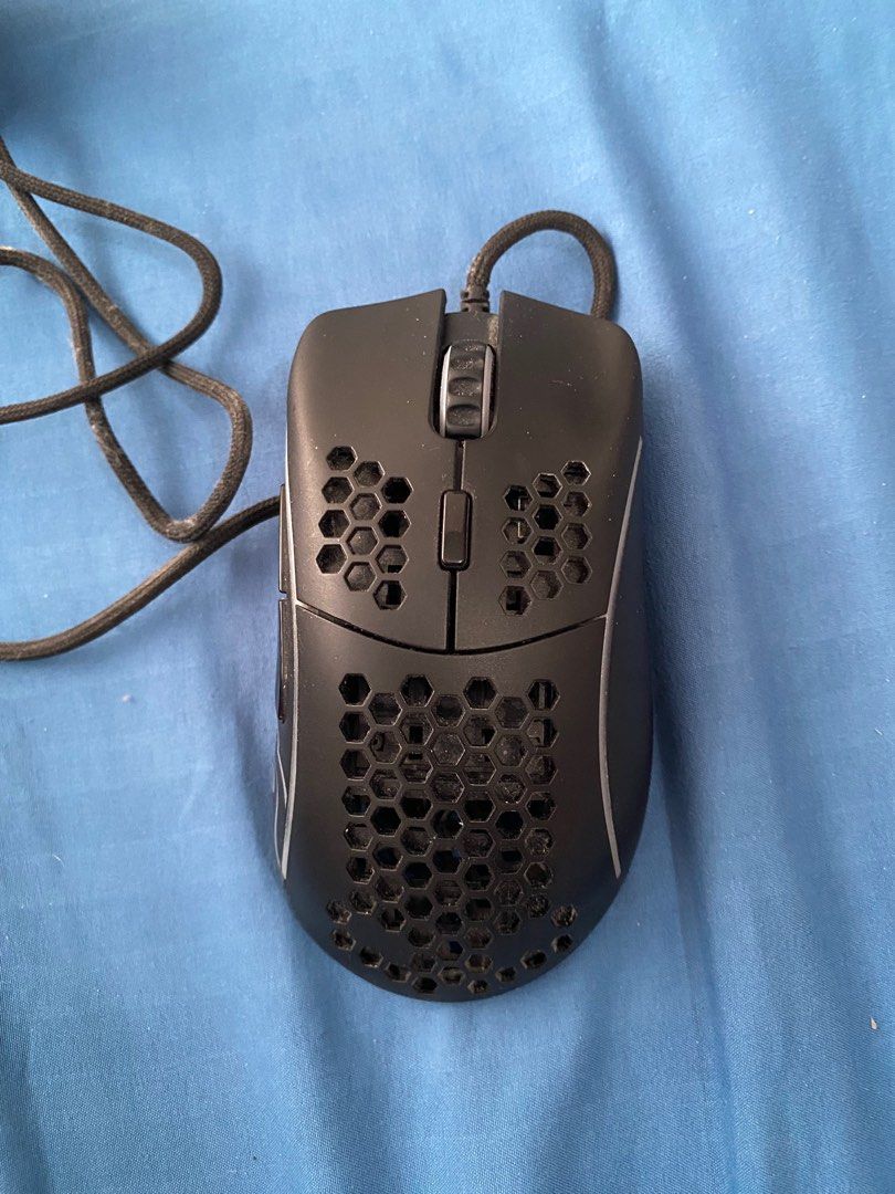As is - Glorious Model D mouse (Category: Mouse & Mousepads) located in Marikina City. Submitted by deon9567 (Listing ID 1361420429, Image 2). Description: Stock picture only for reference Will send better pics of actual mouse upon request Used good (2-3 years) No known issues whatsoever. LED lights still work. Can use minimal cleaning due to dust buildup inside. Signs of wear on left and right side as seen on pic. Mouse skates signs of wear as w