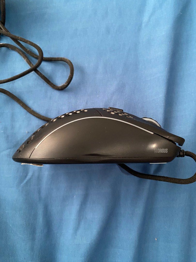 As is - Glorious Model D mouse (Category: Mouse & Mousepads) located in Marikina City. Submitted by deon9567 (Listing ID 1361420429, Image 3). Description: Stock picture only for reference Will send better pics of actual mouse upon request Used good (2-3 years) No known issues whatsoever. LED lights still work. Can use minimal cleaning due to dust buildup inside. Signs of wear on left and right side as seen on pic. Mouse skates signs of wear as w