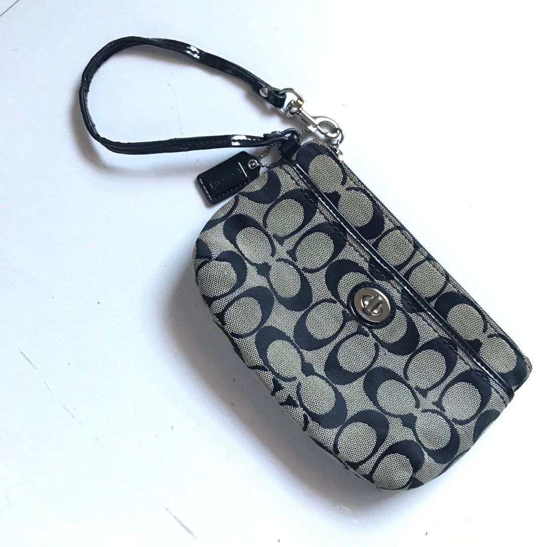 COACH - WRISTLET PURSE (Category: Luxury Bags & Wallets) located in Dasmarinas. Submitted by pseudonym. (Listing ID 1361720238, Image 1). Description: COACH - WRISTLET PURSE can fit iphone16 no issue on canvas wrist strap leather has minimal cracks •feel free to ask •quick replies •shipping via J&T EXPRESS or LALAMOVE *minor imperfections due to previous ownership. *wash before use NO RETURN/NO REFUND.