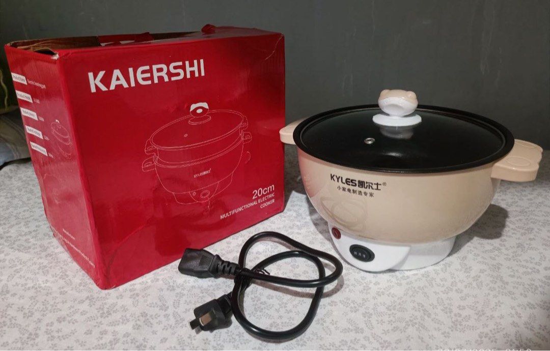 Electric Multicooker (Category: Cookware & Accessories) located in Mandaluyong City. Submitted by prelovedshionista (Listing ID 1361663639, Image 1). Description: 3 button modes Non-stick Slight scratches but still non-stick Location is Carmona Cavite.