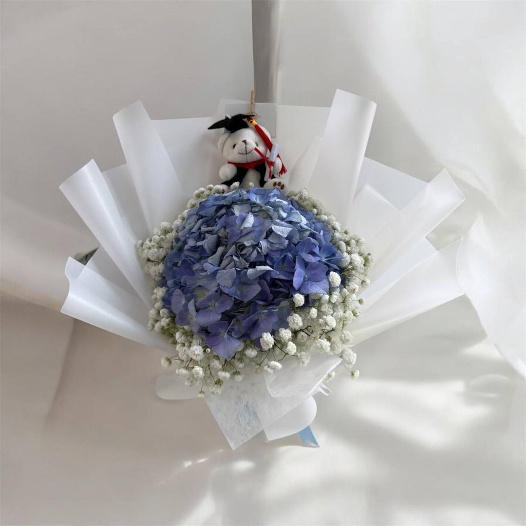 Graduation Bear with Blue Hydrangeas & Baby's Breath Bouquet | Graduation Flowers, Graduation Bouquet, Fresh Flowers, Fresh Flower Bouquet, Fresh Flower Bouquet, Flower Bouquet, Flower Delivery, Hydrangeas, Hydrangea Bouquet, Same Day Delivery (Category: Flowers & Bouquets) located in Singapore. Submitted by flowerfriendsg (Listing ID 1361681705, Image 2). Description: SPECIAL OFFER WHILE STOCKS LAST: BUY 3 GRAD BOUQUETS GET 10% OFF! CHEAPEST IN 