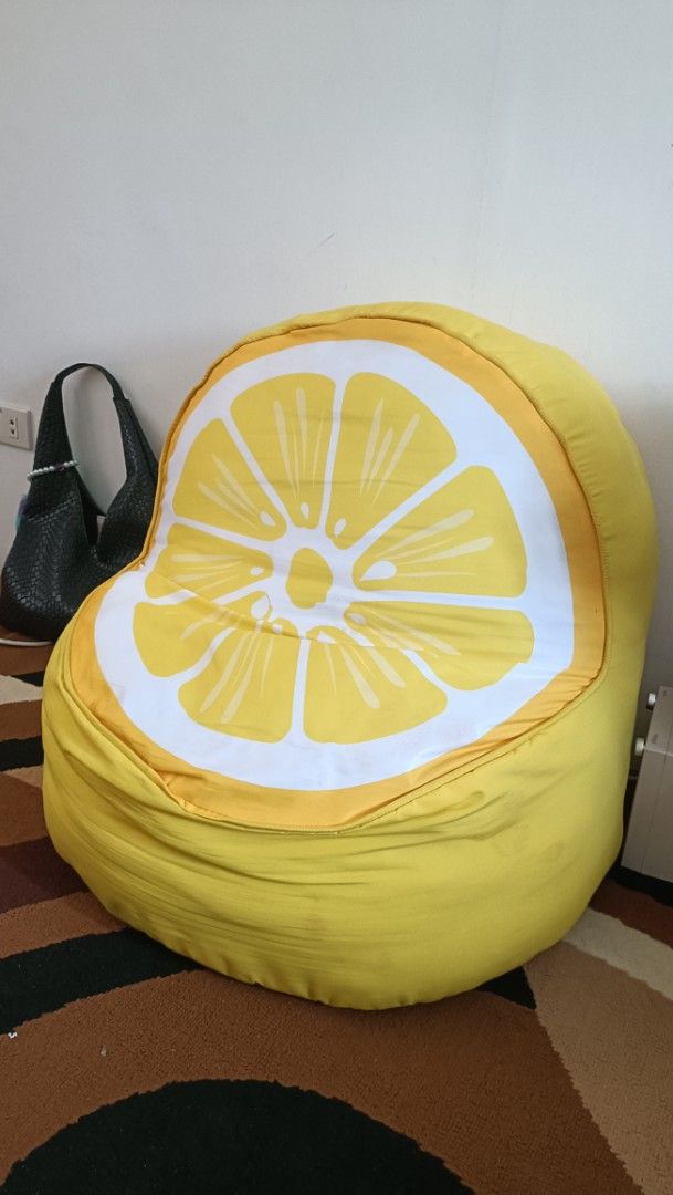 Lemon Bean Bag (Category: Cushions & Throws) located in Valenzuela. Submitted by NA_MI (Listing ID 1361648656, Image 1). Description: Decluttering! W: 19" H: 22" Great for a toddler's room. Has minimal stains. The fabric cover is removable for easy washing..