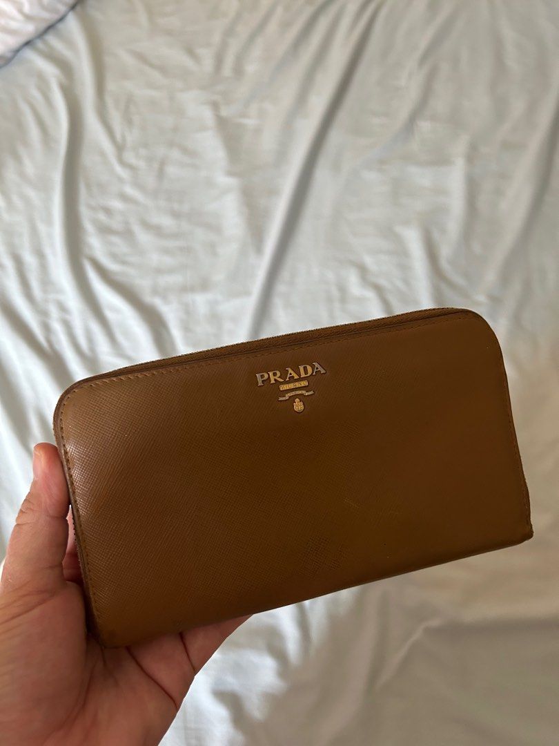 Prada Saffiano (Category: Luxury Bags & Wallets) located in Taguig. Submitted by alex_s. (Listing ID 1361647492, Image 1). Description: Prada Caramel Saffiano 💯 3,5k rfs decluttering slightly nego.