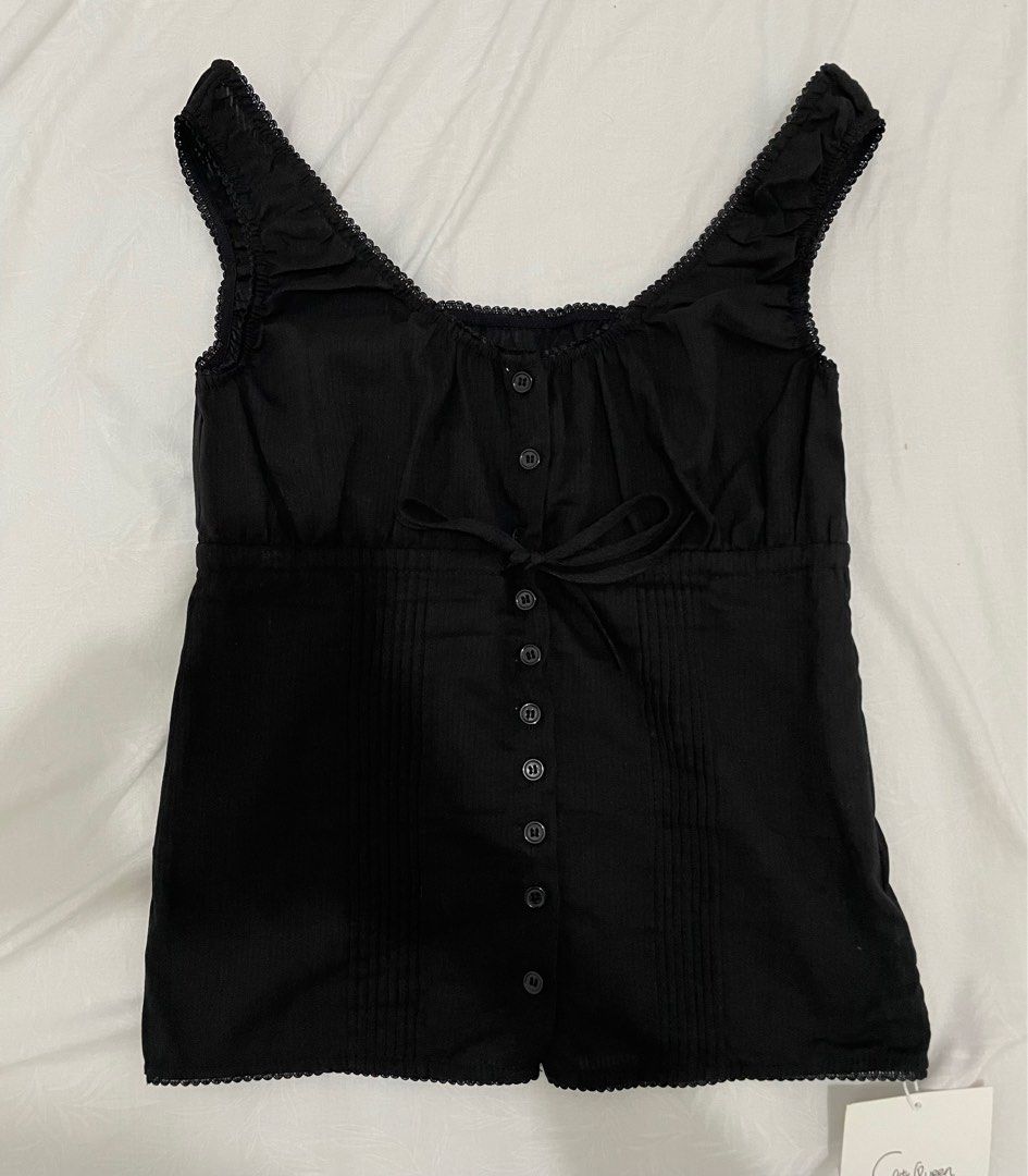 Bkk Dainty Black Top (Category: Sleeveless) located in Manila. Submitted by kayesells_ (Listing ID 1366393512, Image 1). Description: bought from decembers bnew freesize, fits small to large no when worn firm price, won’t entertain lowballers mod: jnt or lalamove loc: sampaloc, manila mop: gcash or bpi.