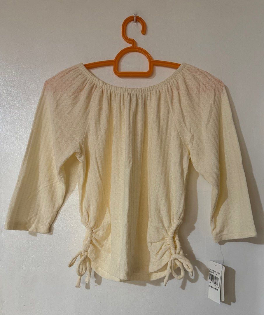 Cream Off the Shoulder Blouse (Category: Blouses) located in Quezon City. Submitted by corncarts (Listing ID 1366414119, Image 1). Description: Brand: Speechless Kids M on tag Polyester/Rayon/Spandex Brand new with tags Cinch Detail on sides Measurements: Bust - 32” Waist - 32” Length - 18”.