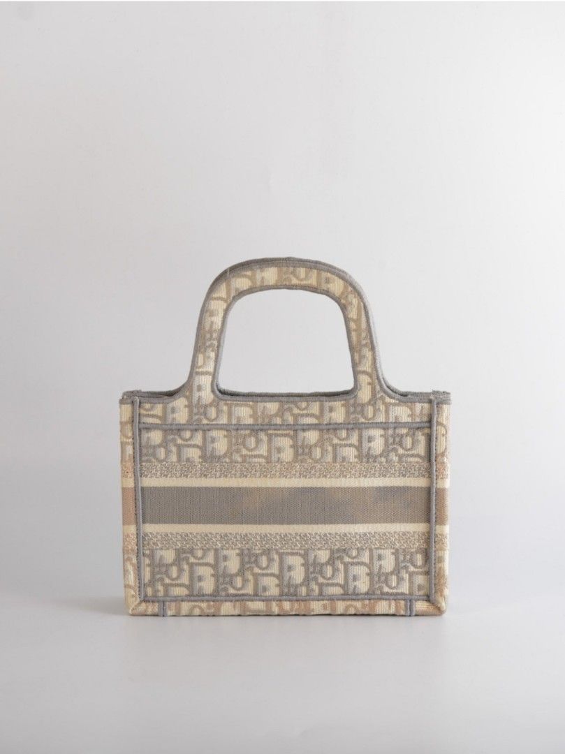 Dior Book Tote Mini Bag In Gray (Category: Luxury Bags & Wallets) located in Taguig. Submitted by pursemaison (Listing ID 1366509237, Image 2). Description: Dior Book Tote Mini Bag In Gray Price: Php 78,000.00 *Additional 4.20% for straight credit card payments *Available for layaway with 1% interest per month (subject to terms & conditions under our Layaway Program) *BDO Credit Card: Up to 36 months installment (1% interest + 2.15% platform fee 