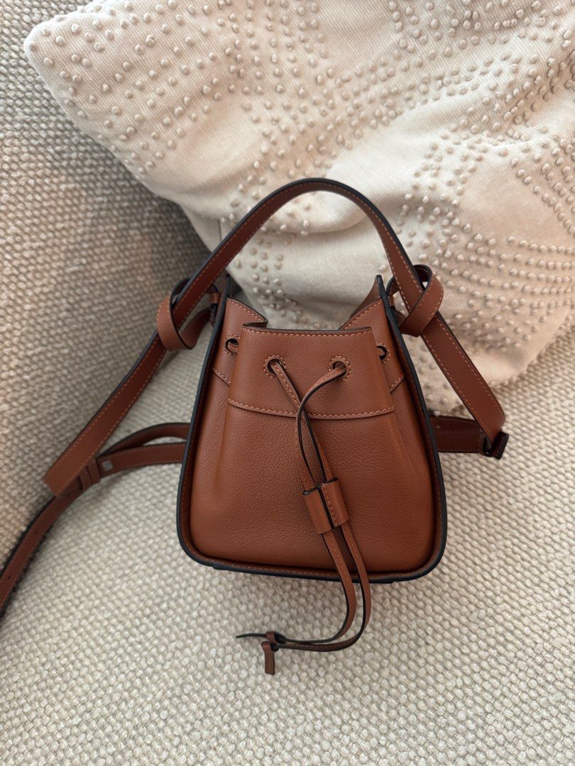Loewe Mini Hammock (2021 original) (Category: Luxury Bags & Wallets) located in Taguig. Submitted by sourcedbym (Listing ID 1366518607, Image 2). Description: Bought for 120K Bought locally in Shang Discontinued so rare!! Beautiful loewe brown color Comes complete #loewe .