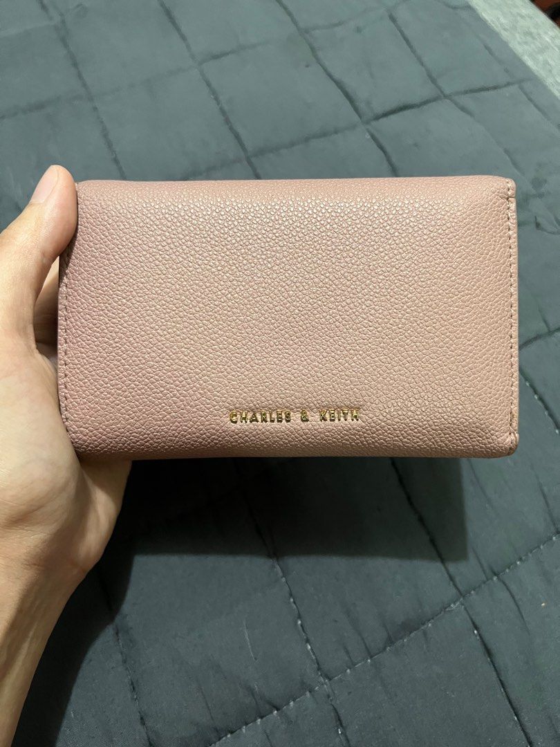 Original Charles and Keith Huxley Front Flap Wallet (Category: Wallets & Card holders) located in Quezon City. Submitted by junieveeee (Listing ID 1366380472, Image 2). Description: Selling Original Charles and Keith Huxley Front Flap Wallet for only 800 ‼️ Good condition with slight discoloration only Loc near fishermall quezon ave Rfs for decluttering purposes.