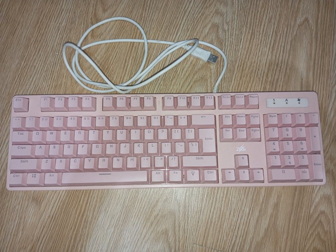 Zeus Pink Wired Gaming Mechanical Keyboard (Category: Computer Keyboard) located in Imus. Submitted by julien.ph (Listing ID 1366488933, Image 1). Description: MODEL: zeus ZK110 May ilang keys na kailangan i-press hard, but it still works..