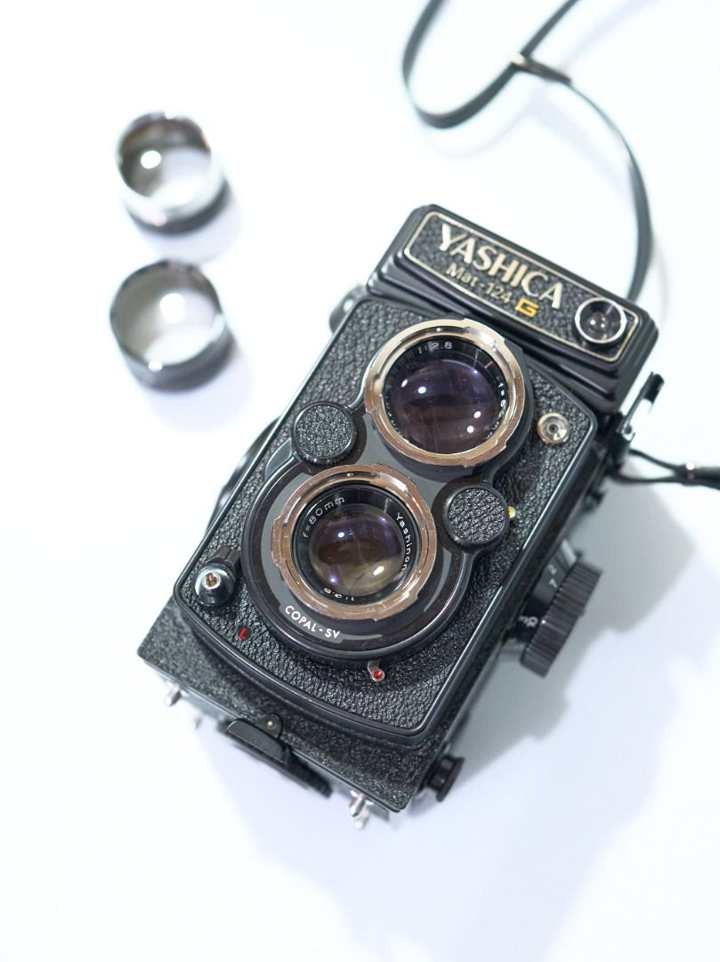 YASHICA MAT 124G TLR MEDIUM FORMAT FILM CAMERA BUNDLE (Category: Cameras) located in Quezon City. Submitted by flikeminks (Listing ID 1366504809, Image 2). Description: YASHICA MAT 124G TLR MEDIUM FORMAT FILM CAMERA BUNDLE Vintage compact TLR camera with fixed 80mm f/3.5 lens Cosmetics: 9/10; very minor signs of use (always used with leather case) Functionality: 10/10; light meter confirmed working Optics: 8/10; no fungus, no scratches, some noti