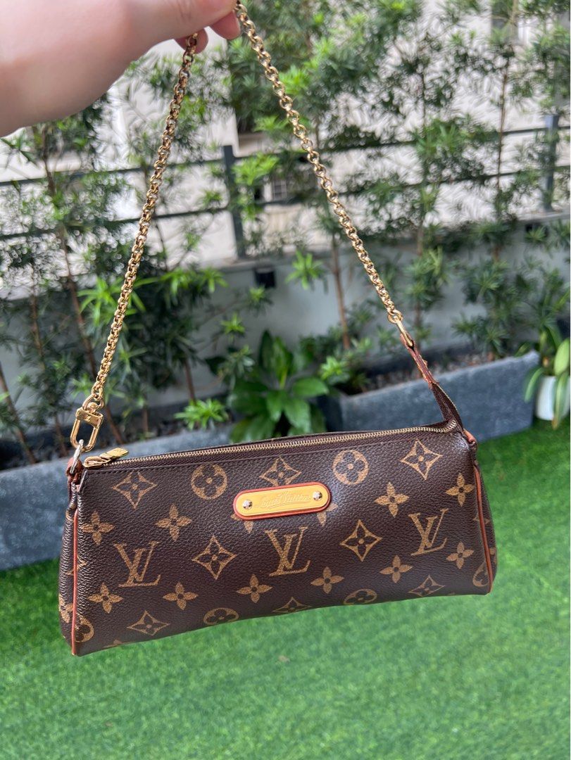 Authentic Louis Vuitton Eva Monogram Clutch Two-Way Shoulder Bag (Category: Luxury Bags & Wallets) located in Makati City. Submitted by cindiorella (Listing ID 1360514656, Image 1). Description: 100% guaranteed authentic Comes with dust bag & long vachetta strap Date Code: SD2059.