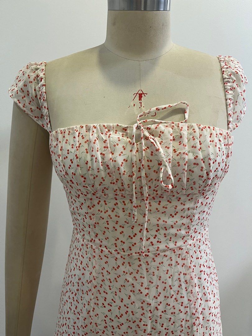Cherry Print Midi Dress with Slit (Category: Dresses) located in Pasig City. Submitted by macncheese19 (Listing ID 1361887129, Image 2). Description: -bought from Pomelo online -chiffon material -super cute in person, perfect for date nights or other events -adjustable tie in front to secure the neckline -side zipper and smocked back -has a slit for that flirty look -can fit size XS-S.