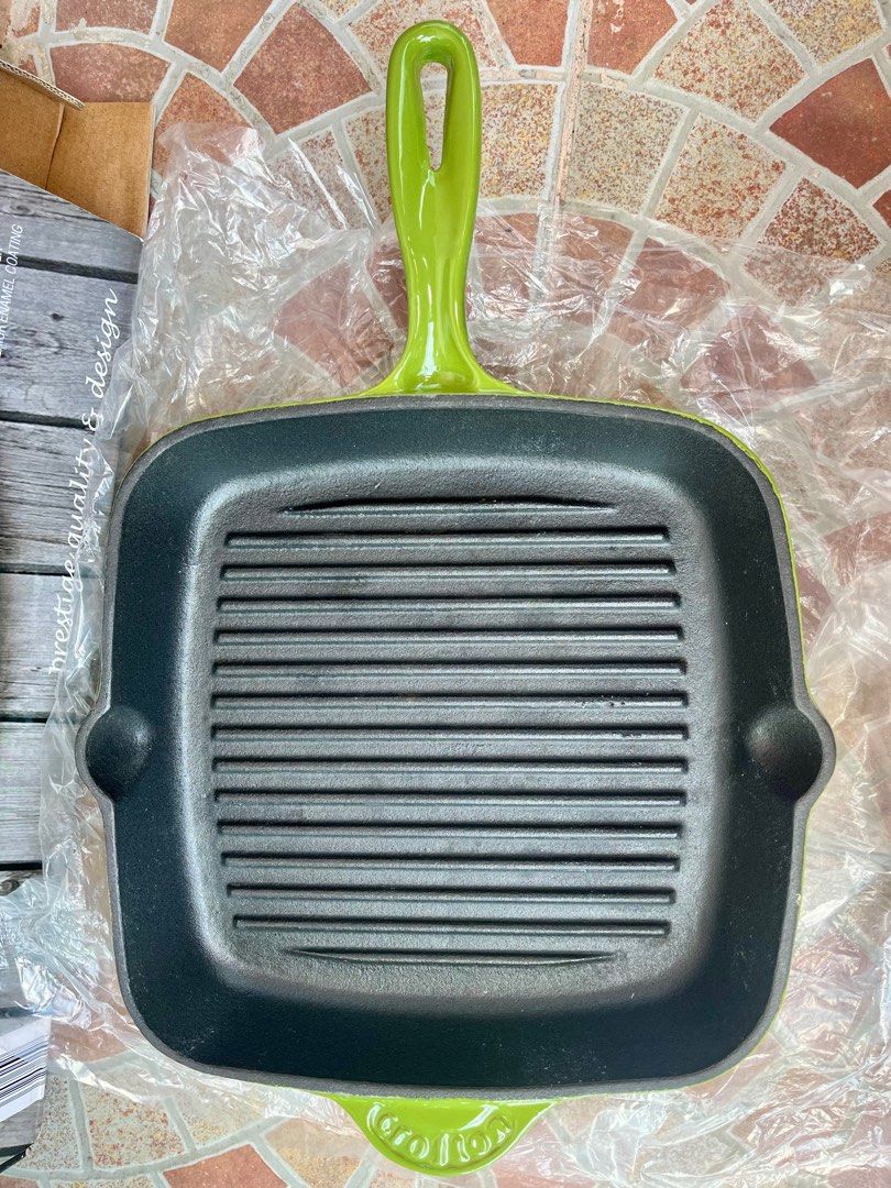 Crofton Professional Cast Iron Griddle Pan (Category: Cookware & Accessories) located in La Trinidad. Submitted by whatnotcollections (Listing ID 1361886035, Image 2). Description: In excellent condition. The pan has a light green enamel coating on the exterior and a black interior. Heavy Duty Cast Iron Body and a High Quality 3 Layer Exterior Enamel Coating..