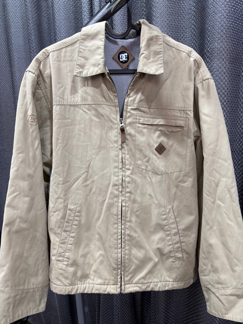 DC Jacket (Category: Coats, Jackets and Outerwear) located in Shah Alam. Submitted by prelovedbyadeli (Listing ID 1361879566, Image 1). Description: DC Jacket Pit: 22 Labuh: 25 Colour: Beige Condition: 10/10 Siap Cuci✅ Pm for more details!.
