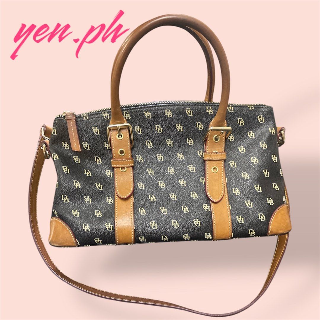 Dooney & Bourke Black and Brown Bag (Category: Luxury Bags & Wallets) located in Santa Rosa. Submitted by yen.ph (Listing ID 1361851451, Image 3). Description: Color: Black with tan trimming Size (Approx): 13in (W) x 8in (H) x 5in (D) Bought from the US. 100% original Dooney & Bourke bag.