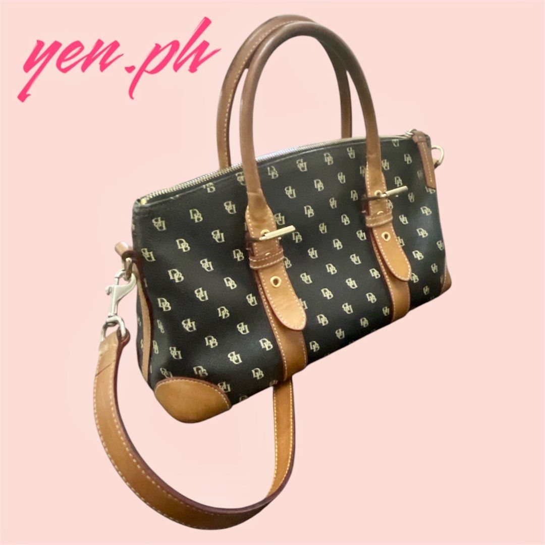 Dooney & Bourke Black and Brown Bag (Category: Luxury Bags & Wallets) located in Santa Rosa. Submitted by yen.ph (Listing ID 1361851451, Image 2). Description: Color: Black with tan trimming Size (Approx): 13in (W) x 8in (H) x 5in (D) Bought from the US. 100% original Dooney & Bourke bag.
