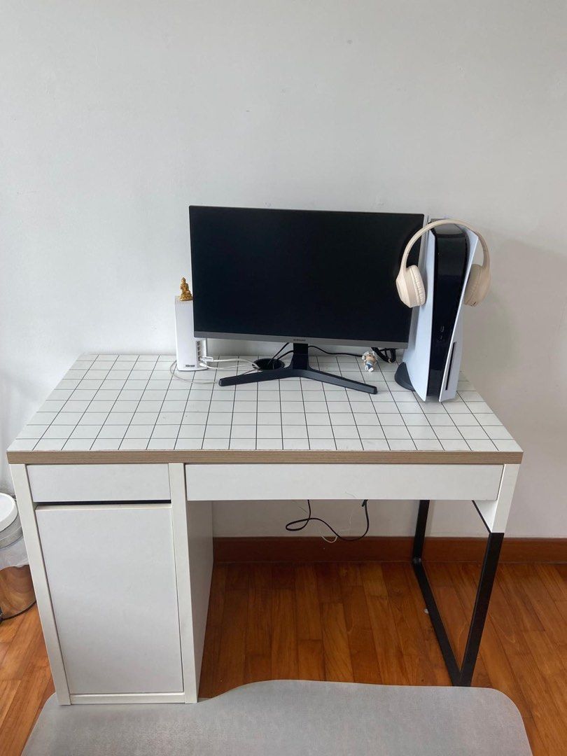 IKEA Study Table (Category: Tables & Sets) located in Singapore. Submitted by losales28 (Listing ID 1361834288, Image 1). Description: White and black checkered study/work desk Well maintained 3 storage compartments plus space for wires, etc. for electronics Measurements - 29x41.5 inches (LxW).