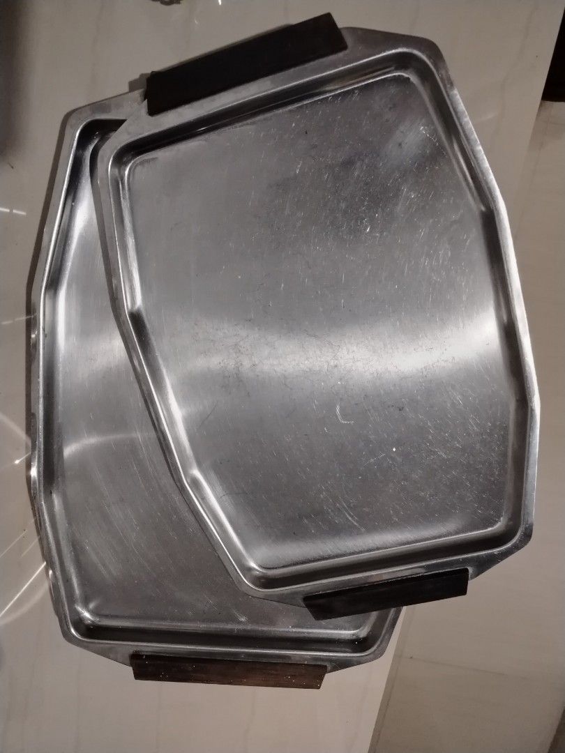 Vintage Serving Tray stainless with wooden handle (Bundle) (Category: Other Kitchenware & Tableware) located in Parang, Maguindanao. Submitted by lawon_koleksyon (Listing ID 1361937482, Image 1). Description: The image shows a mid-century modern serving tray, likely of Danish design. Key features include: Material: Stainless steel with teak handles. Style: Clean lines, typical of mid-century Danish design. Function: Used for serving food or drink