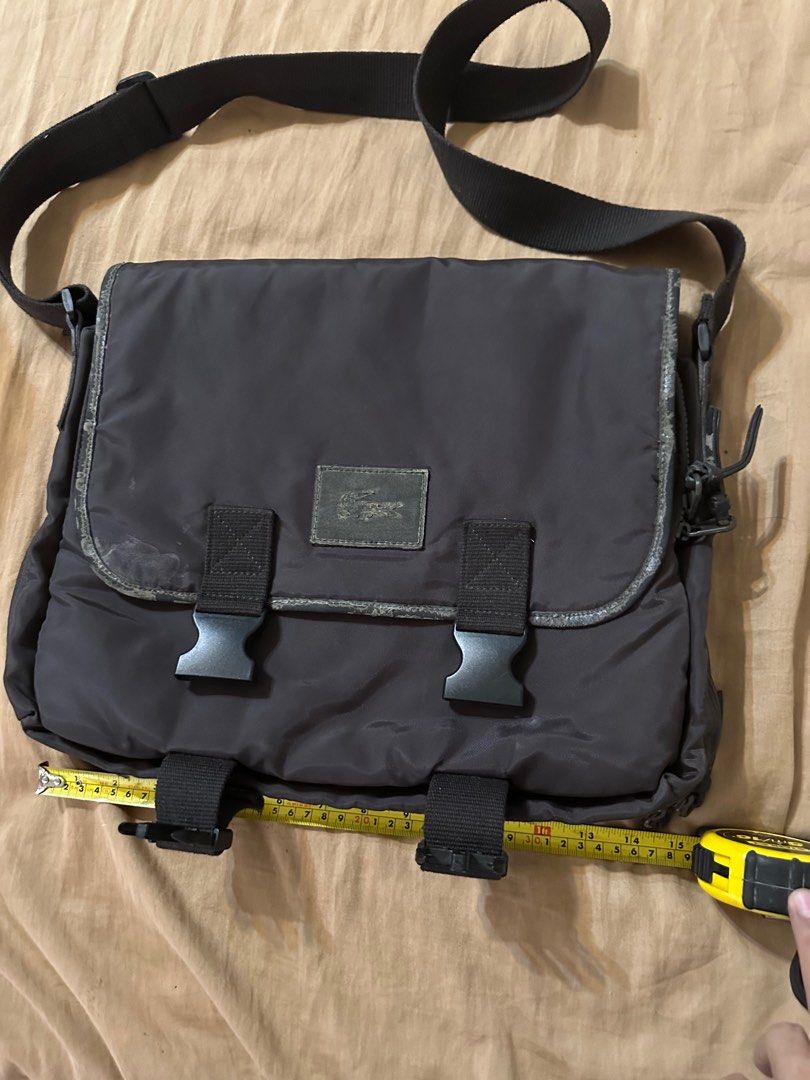 Authentic Lacoste mens sling messenger bag (Category: Sling Bags) located in Cebu City. Submitted by drebdy (Listing ID 1362062401, Image 1). Description: Authentic Lacoste mens sling messenger bag all zippers and locks good working issue only on leather trims fading bak bak and stains but inside of the bag is very clean and good item in cebu cab ship thru jnt at buyers cost prior gcash paymebt required.