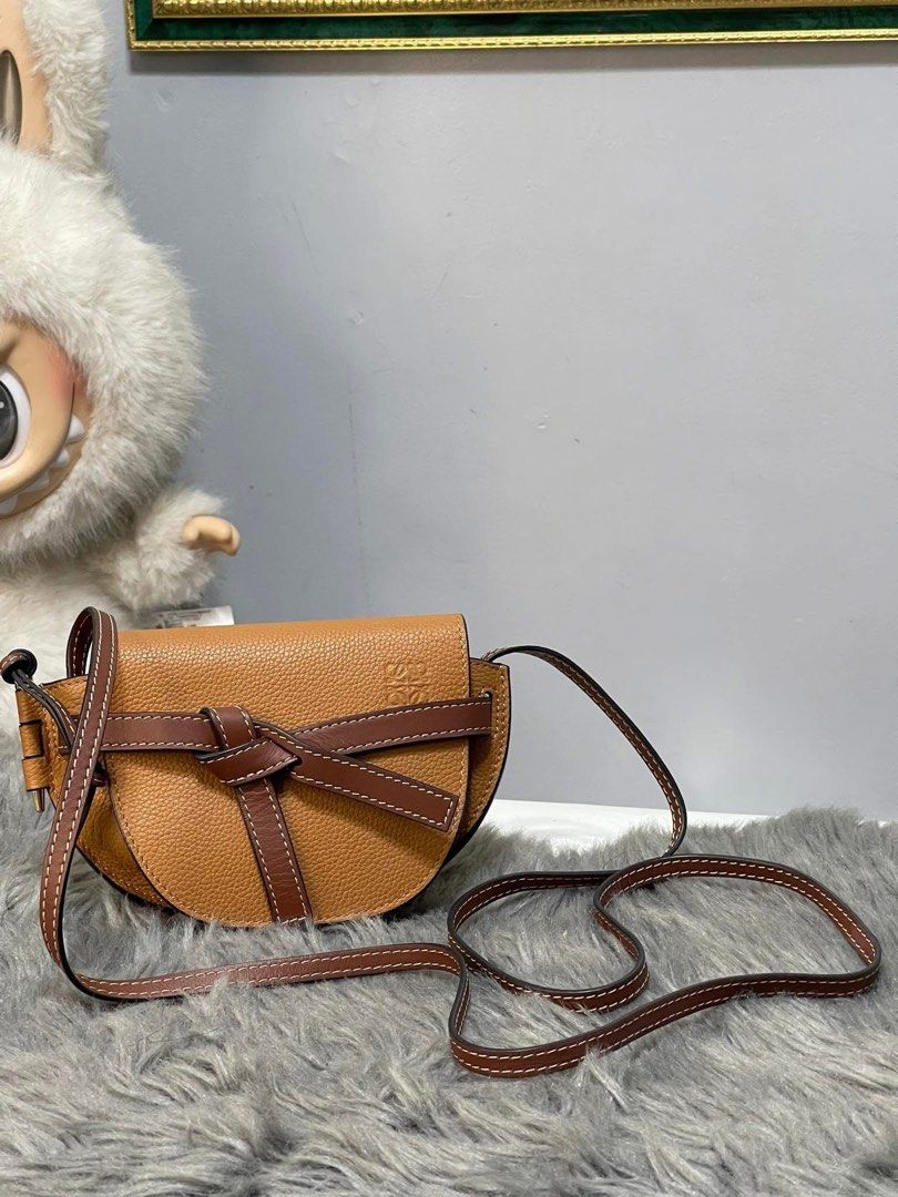 Authentic Loewe ❣️gate mini grained tan (Category: Luxury Bags & Wallets) located in Quezon City. Submitted by jhaediah (Listing ID 1362067807, Image 1). Description: ❣️gate mini grained tan Lightly used condition Inclusions: dustbag, booklet code 16 .