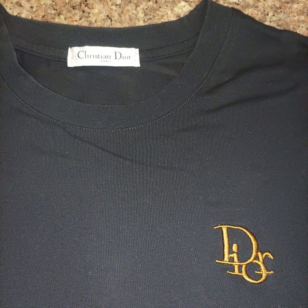 Christian Dior Black Shirt (Category: Tshirts & Polo Shirts ) located in Davao. Submitted by gcollection (Listing ID 1362045129, Image 3). Description: Christian Dior Black Shirt Made in Italy Size: Medium (20” x 27”) Condition: Excellent Color rate: 9.6/10 No Issues / Cut Wash Tag Only / OFF LEGIT .