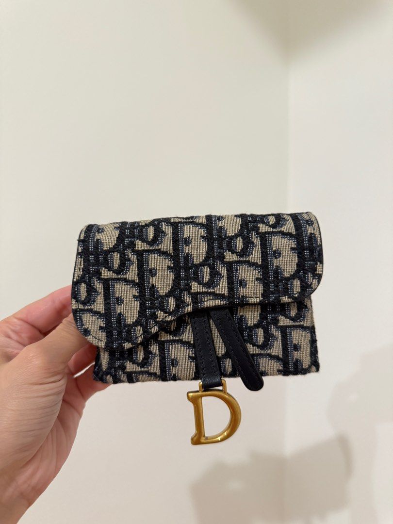 Dior Oblique Wallet on Chain (Category: Luxury Bags & Wallets) located in Manila. Submitted by luxpreloved_ (Listing ID 1362082336, Image 3). Description: Dior Oblique Wallet on Chain Can be worn multiple ways (with chain or mo chain) and has a belt slot at the back, can also be worn as a belt bag. Inclusions: - Box - Dust bags - Original chain Negotiable.
