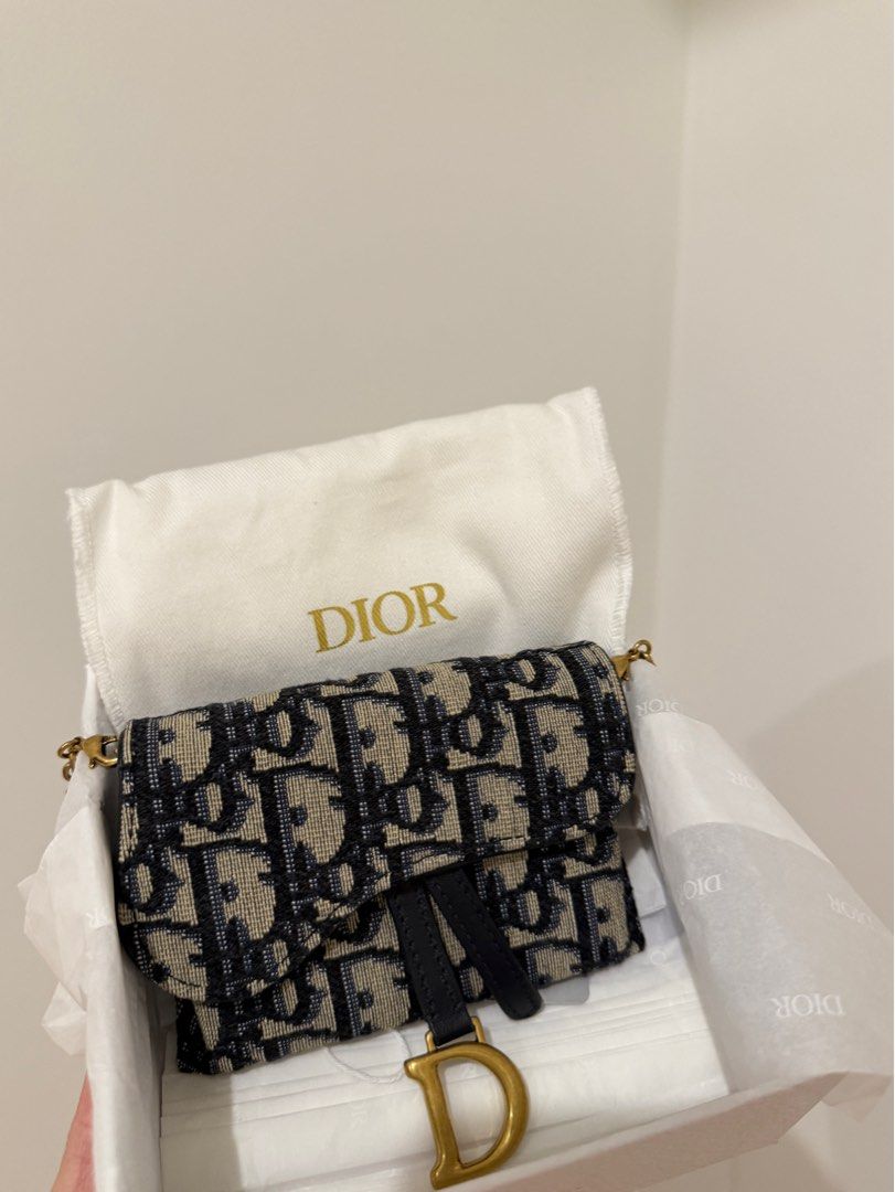 Dior Oblique Wallet on Chain (Category: Luxury Bags & Wallets) located in Manila. Submitted by luxpreloved_ (Listing ID 1362082336, Image 2). Description: Dior Oblique Wallet on Chain Can be worn multiple ways (with chain or mo chain) and has a belt slot at the back, can also be worn as a belt bag. Inclusions: - Box - Dust bags - Original chain Negotiable.