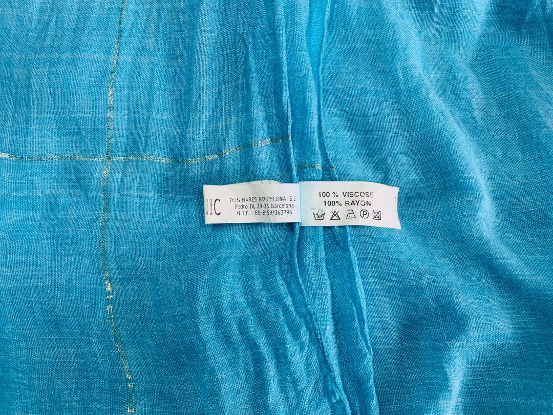 Dos Mares Sarong. Aquamarine. (Category: Bikinis & Swimsuits) located in Makati City. Submitted by pippacee (Listing ID 1361989305, Image 3). Description: Dos Mares Sarong. Aquamarine with gold thread border. Made in Spain. 100% Rayon. 34” x 57”. *Note: some tangled/ missing tassles..