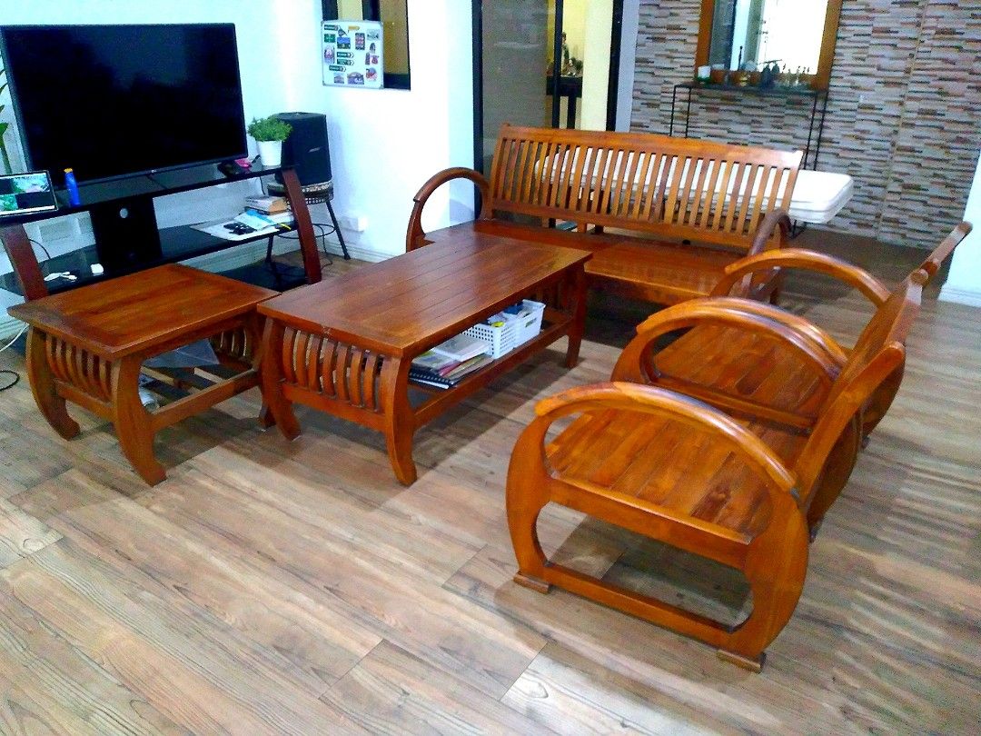 SOLID WOOD SOFA SET / SALA SET (Category: Sofas) located in Quezon City. Submitted by dekks_sulit (Listing ID 1361990747, Image 1). Description: HANDCRAFTED SOLID TEAK WOOD SOFA SET 1 3 SEATER 2 1 SEATER 1 COFFEE TABLE/CENTER TABLE 1 SIDE TABLE USED / PRELOVED.