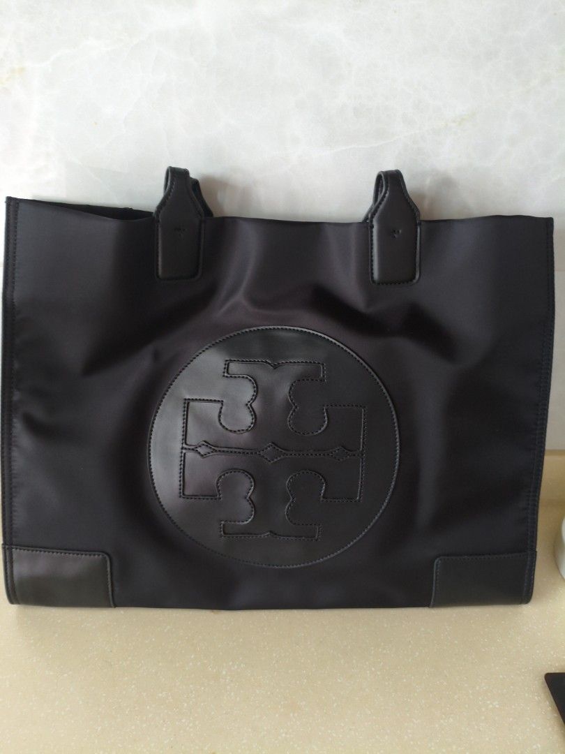 Tory Burch bag large (Category: Tote Bags) located in Singapore. Submitted by mrssan (Listing ID 1361959743, Image 1). Description: still in good condition except the strap, some peeling bag is still in good condition nego for cash n carry...