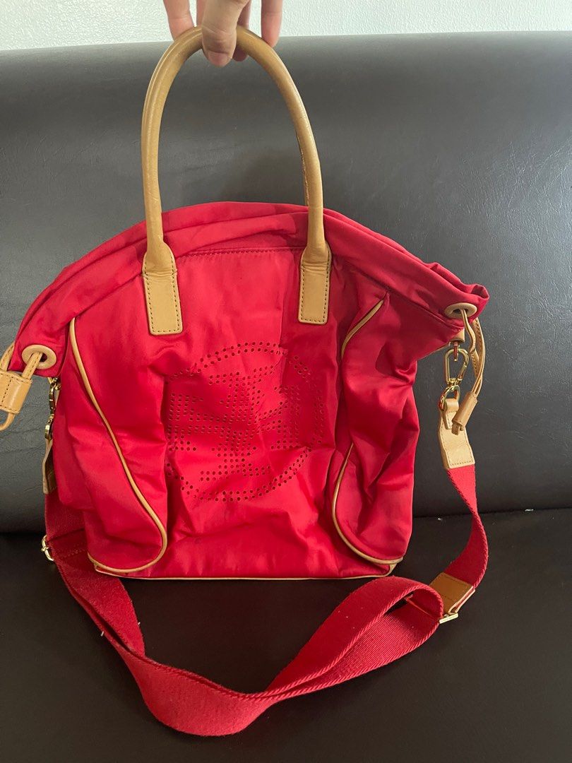Tory Burch Red Cross-body Bag Authentic (Category: Luxury Bags & Wallets) located in Balanga. Submitted by macoylit21 (Listing ID 1361972513, Image 1). Description: Authentic Tory Burch Red Cross-body Bag Minor wear on handle .