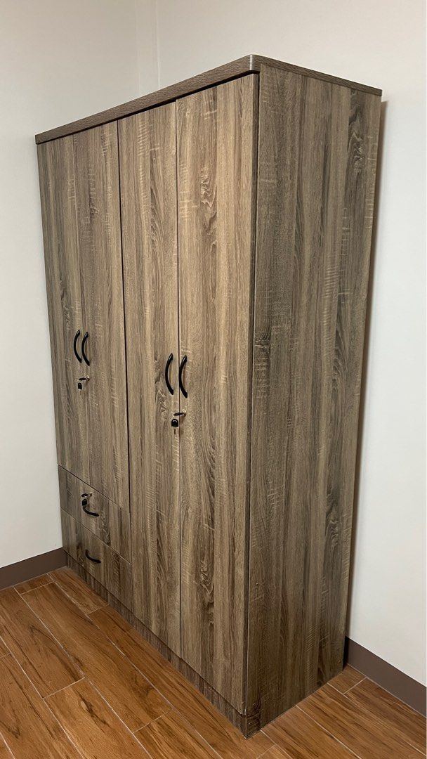 Wardrobe Cabinet (Category: Shelves, Cabinets & Racks) located in Makati City. Submitted by berniebones (Listing ID 1361963912, Image 2). Description: Wardrobe Cabinet Color: Brown Material: Wood Size: 180x120x47cm (HLW) With 2 drawers With lock keys I suggest personal pick-up to prevent damage..