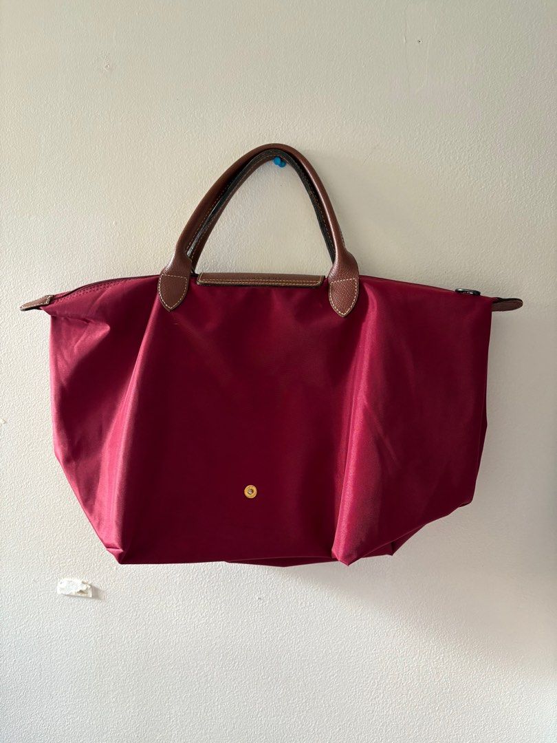 Authentic Longchamp Le Pliage Bag Large Short Handle (Category: Luxury Bags & Wallets) located in Muntinlupa City. Submitted by take2mnl (Listing ID 1362133212, Image 2). Description: Authentic Longchamp Short Handle Bag In Excellent Used Condition Kindly self authenticate if in doubt. Color: Wine Red Super good deal. RFS: Bought a new one..