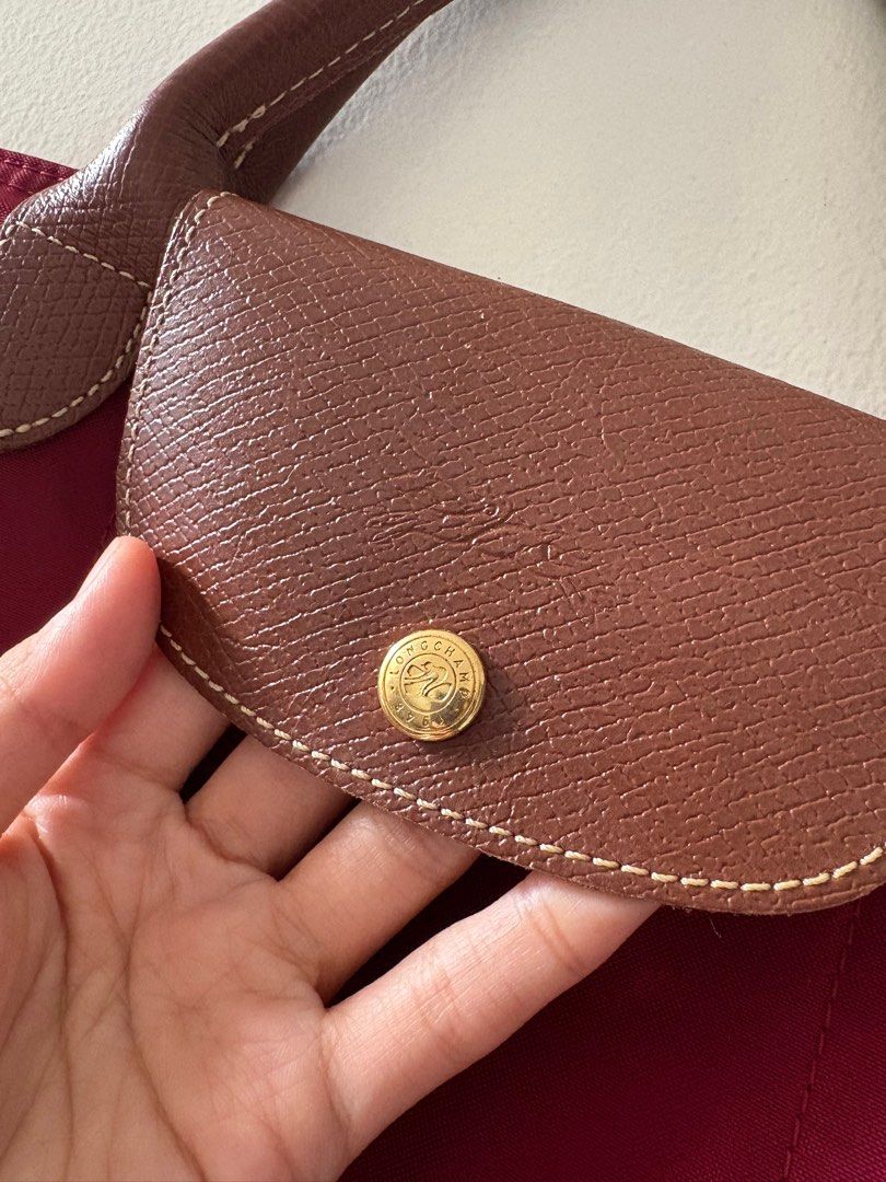 Authentic Longchamp Le Pliage Bag Large Short Handle (Category: Luxury Bags & Wallets) located in Muntinlupa City. Submitted by take2mnl (Listing ID 1362133212, Image 3). Description: Authentic Longchamp Short Handle Bag In Excellent Used Condition Kindly self authenticate if in doubt. Color: Wine Red Super good deal. RFS: Bought a new one..
