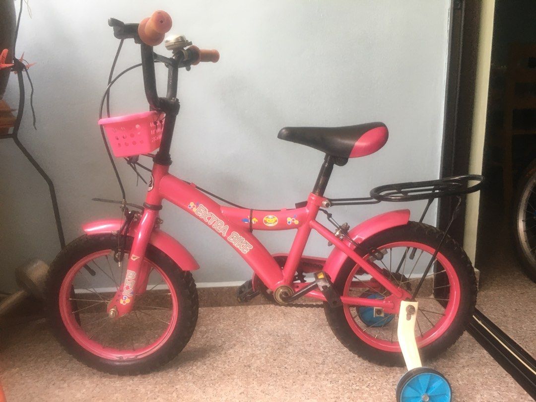 BMX Children bike (Category: Bicycles) located in Singapore. Submitted by PeterCPeter (Listing ID 1296337566, Image 1). Description: 14” BMX children bike, Very good condition clean & no rust, Well maintenance ,clean, for age 6~12yo, Handle bar n seat can adjust to height ,Fitted with training wheels..