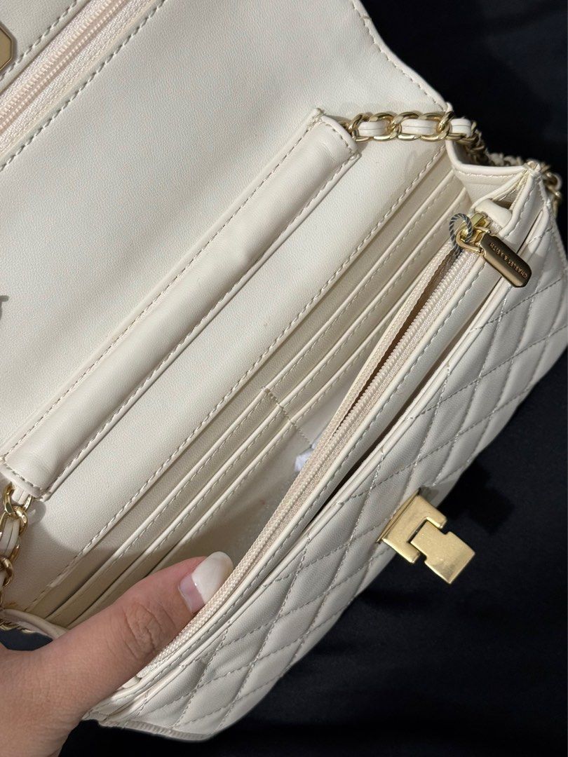 Charles and keith white wallet on chain bag (Category: Cross-body Bags) located in Manila. Submitted by aaldpn (Listing ID 1362248111, Image 3). Description: Can shorten strap (see photo) Has many compartments What you see is what you get Minimal discoloration mostly on the back of the bag (see photos) Slightly negotiable .