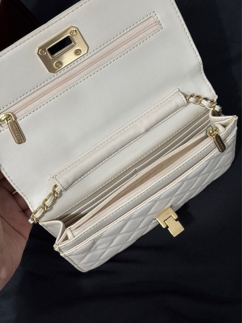 Charles and keith white wallet on chain bag (Category: Cross-body Bags) located in Manila. Submitted by aaldpn (Listing ID 1362248111, Image 2). Description: Can shorten strap (see photo) Has many compartments What you see is what you get Minimal discoloration mostly on the back of the bag (see photos) Slightly negotiable .