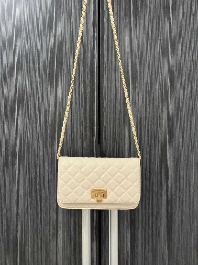 Charles and keith white wallet on chain bag (Category: Cross-body Bags) located in Manila. Submitted by aaldpn (Listing ID 1362248111, Image 1). Description: Can shorten strap (see photo) Has many compartments What you see is what you get Minimal discoloration mostly on the back of the bag (see photos) Slightly negotiable .