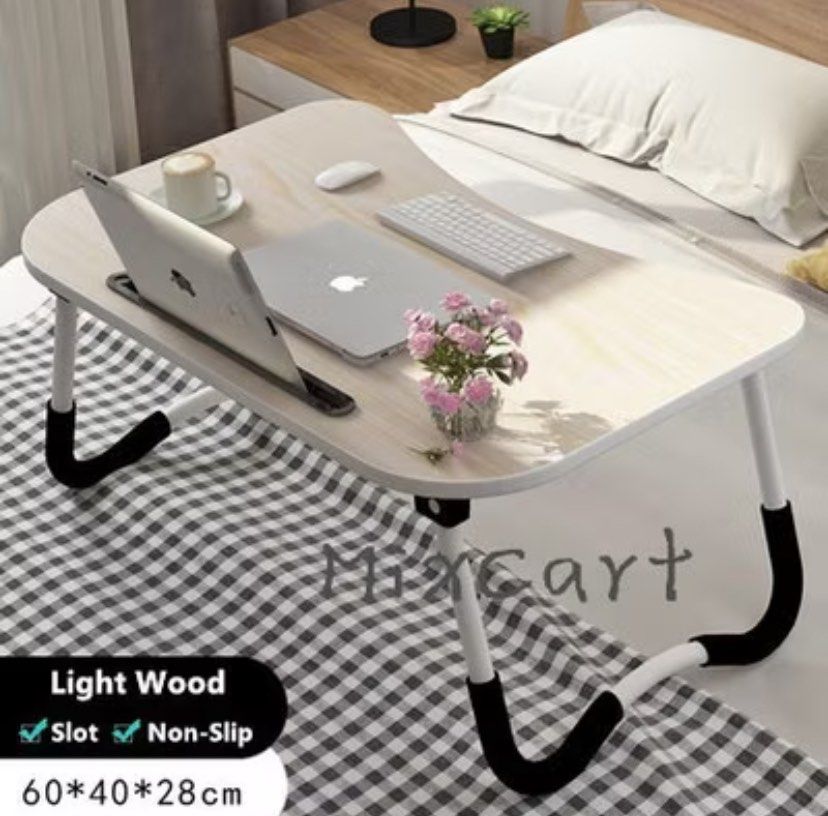 Foldable Table/bed table (Category: Tables & Sets) located in Singapore. Submitted by yuki_000 (Listing ID 1362163142, Image 1). Description: Laptop Table/ Bed Table Foldable Wood Desk.