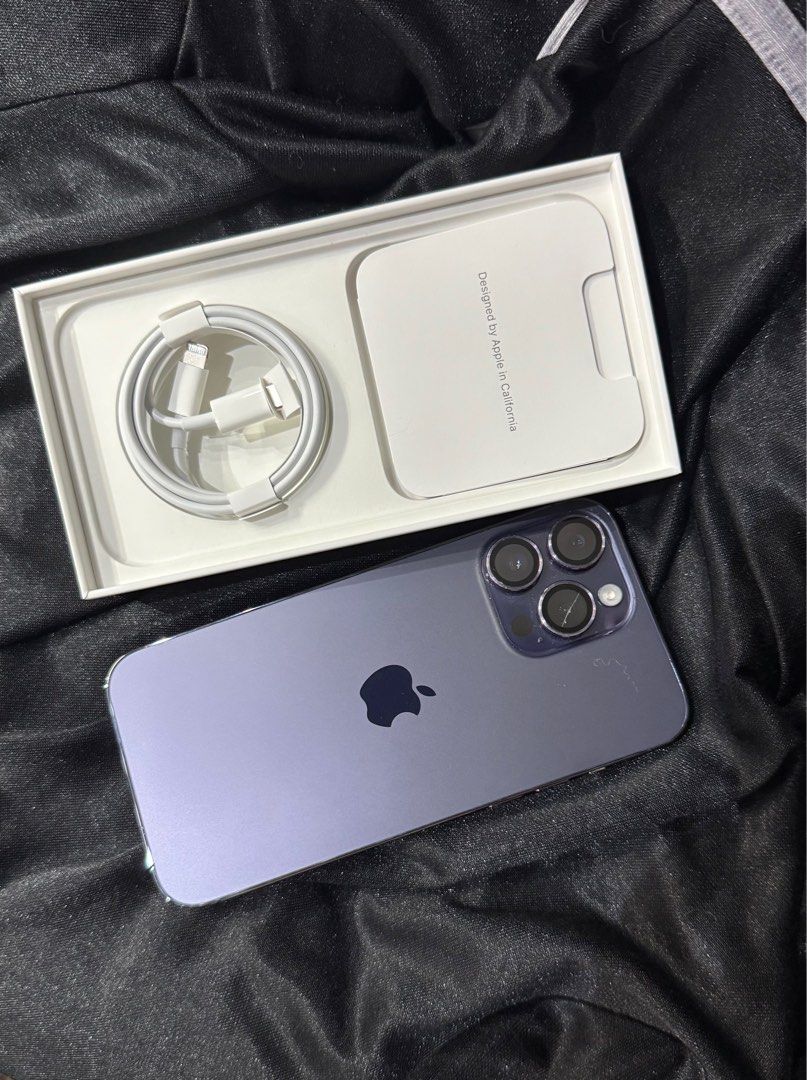 IPHONE 14 PRO MAX 1TB (Category: iPhone 14 Series) located in Quezon City. Submitted by abbynf (Listing ID 1362229844, Image 1). Description: Deep Purple 1TB Battery Health : 89 percent Has a scratch on one of the camera lens but no effect naman on camera. Conplete with box and unused cord.