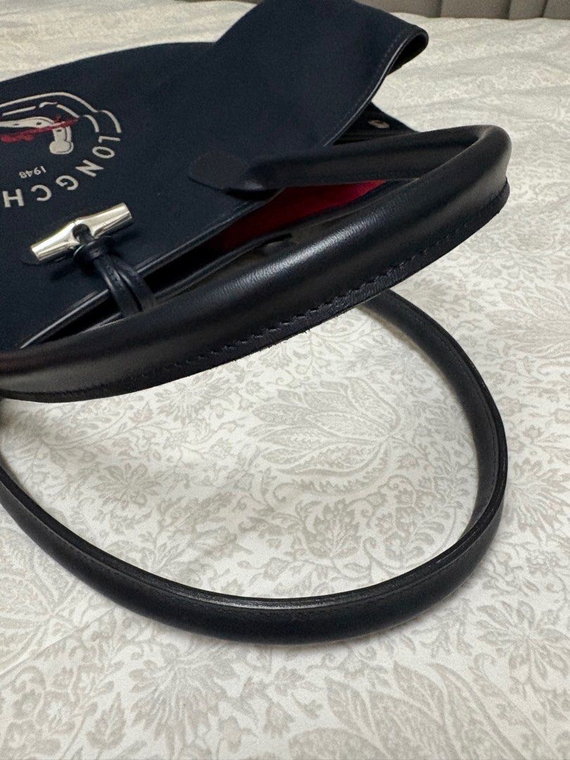 Longchamp Roseau XL bag (Category: Luxury Bags & Wallets) located in Cavite. Submitted by aerie1219 (Listing ID 1362250846, Image 3). Description: Bought from the UK. Bag only, i no longer have the dust bag and receipts. Very good condition with Just one light scratch at the bottom part (see photo). This is a large bag, great for weekend trips, if you want that extra nice bag to hold yourstuff. +Lsf by buyer.