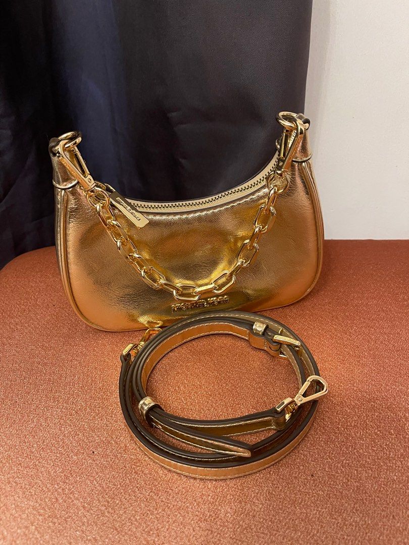 MK Cora XS pebbled bag (Category: Luxury Bags & Wallets) located in General Trias. Submitted by love_by_ann (Listing ID 1362157171, Image 3). Description: Selling my MK Cora bag XS size Can fit few makeup, cellphone Used once in wedding lang.