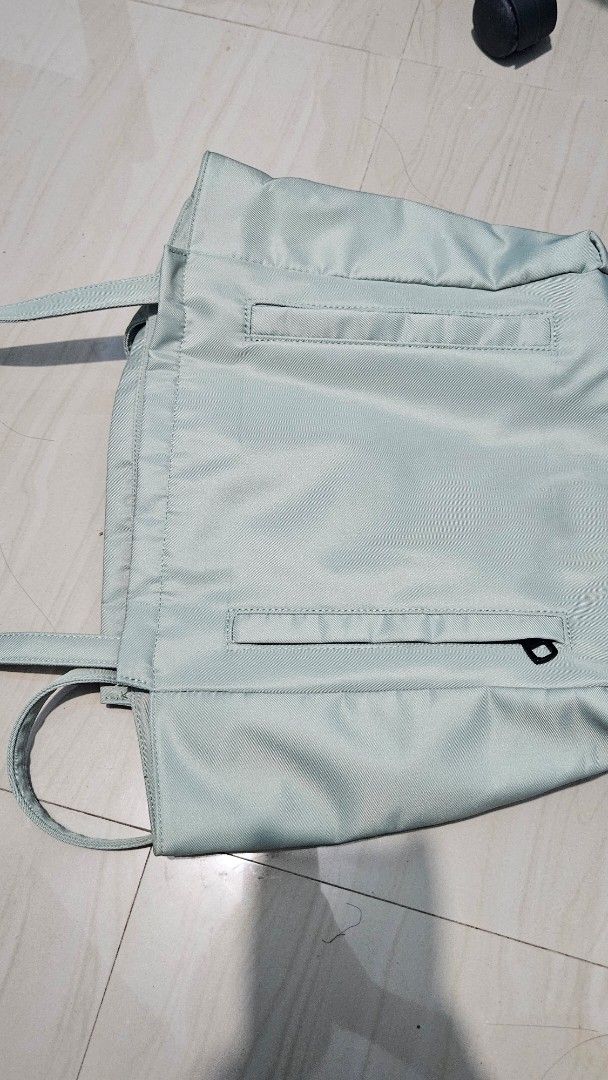 Sage green school office tote bag (Category: Tote Bags) located in Naga. Submitted by abbycatph (Listing ID 1362192445, Image 3). Description: •NEVER USED, just stored •super cute and spacious, just the right size •when worn photo is exactly as in the first photo •can fit probably up to 14inch laptop? •Originally bought for P500+ •RFS: decluttering.